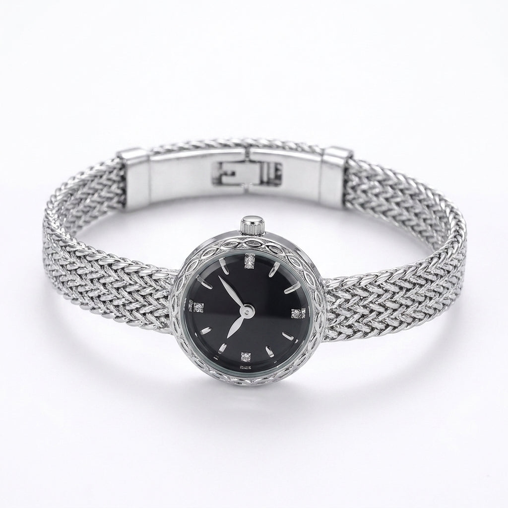 Silver-toned Époque Weave Watch with black dial, diamond markers, intricate bezel, and braided stainless steel bracelet, captured on a white background.