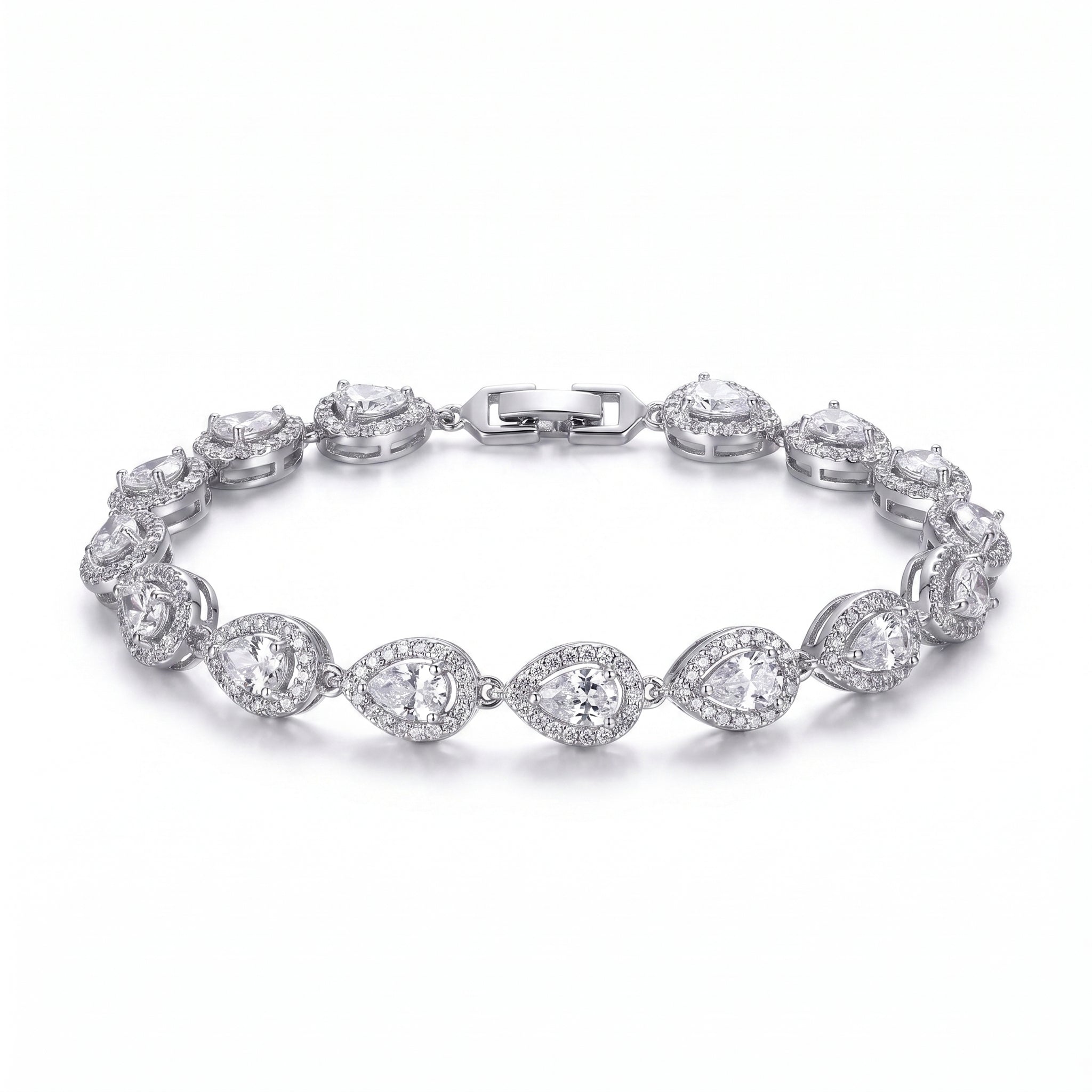A woman's arm wearing a sparkling rhodium-plated bracelet featuring pear-cut zircon stones, each framed by a pave halo, exuding refined elegance.