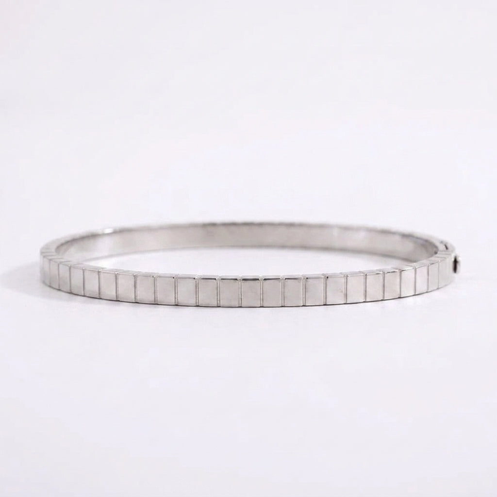 Modern silver titanium steel electroplated bracelet, a waterproof and affordable jewelry piece with a unique geometric design.