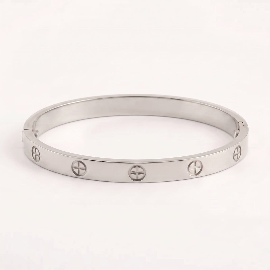 Waterproof titanium steel plated bangle bracelet, showcasing iconic screw details on a white background.