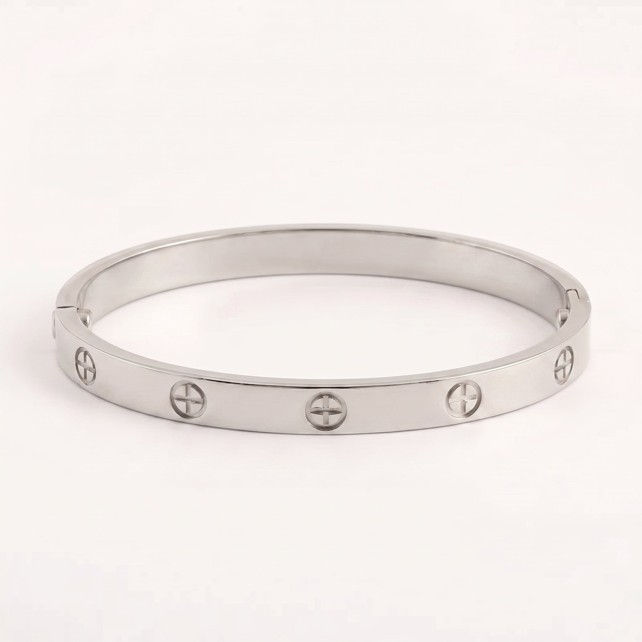 Waterproof titanium steel plated bangle bracelet, showcasing iconic screw details on a white background.