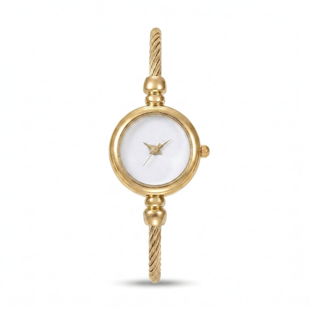An elegant gold-tone women's bangle watch with a twisted bracelet band and a clean white dial, isolated on a white background.