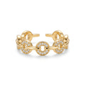 Detailed close-up of the gold-plated Pavé Link Ring featuring brilliant pavé zirconia on circular links and an adjustable open band, set against a pristine white background.