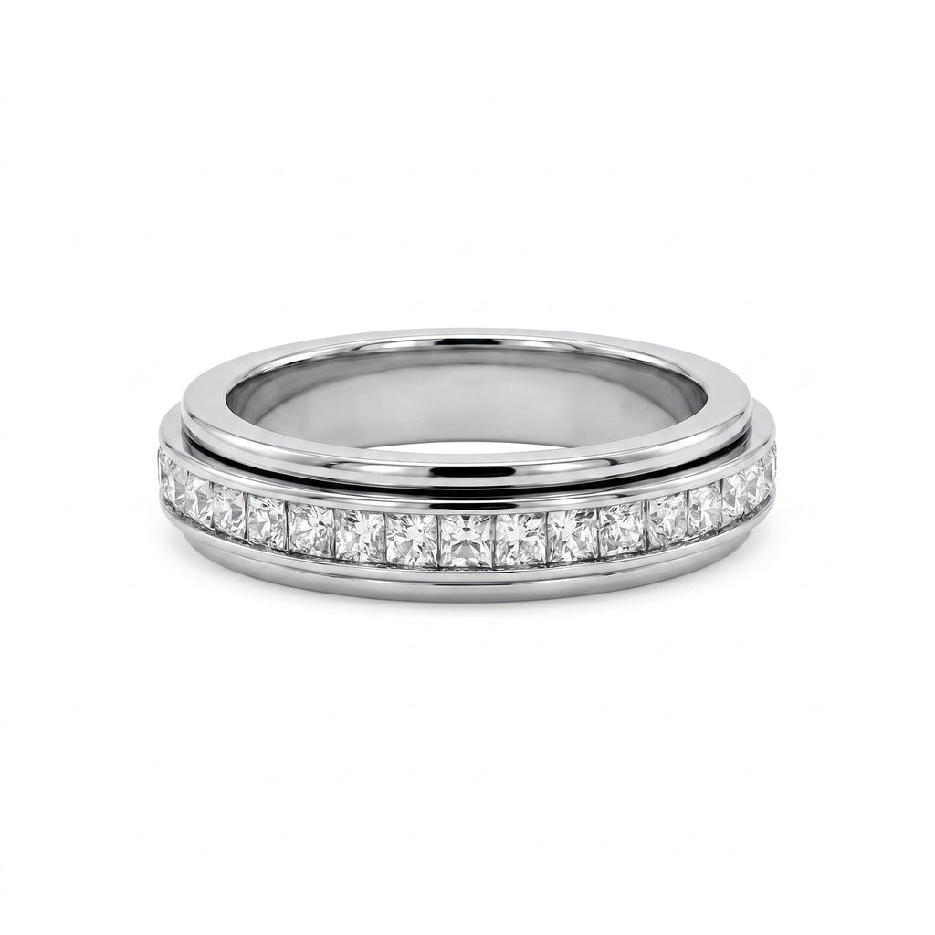 Close-up studio shot of a luxurious white gold motion band, adorned with a rotating row of sparkling princess-cut diamonds.