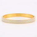 Waterproof gold-plated titanium steel zircon bangle, a luxurious yet affordable jewelry piece with sparkling zircons.