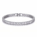 Close-up of a platinum-plated tennis bracelet with brilliant baguette-cut zircon stones and a secure box clasp, against a white background.