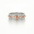 Silver ring with a heart charm on a white background